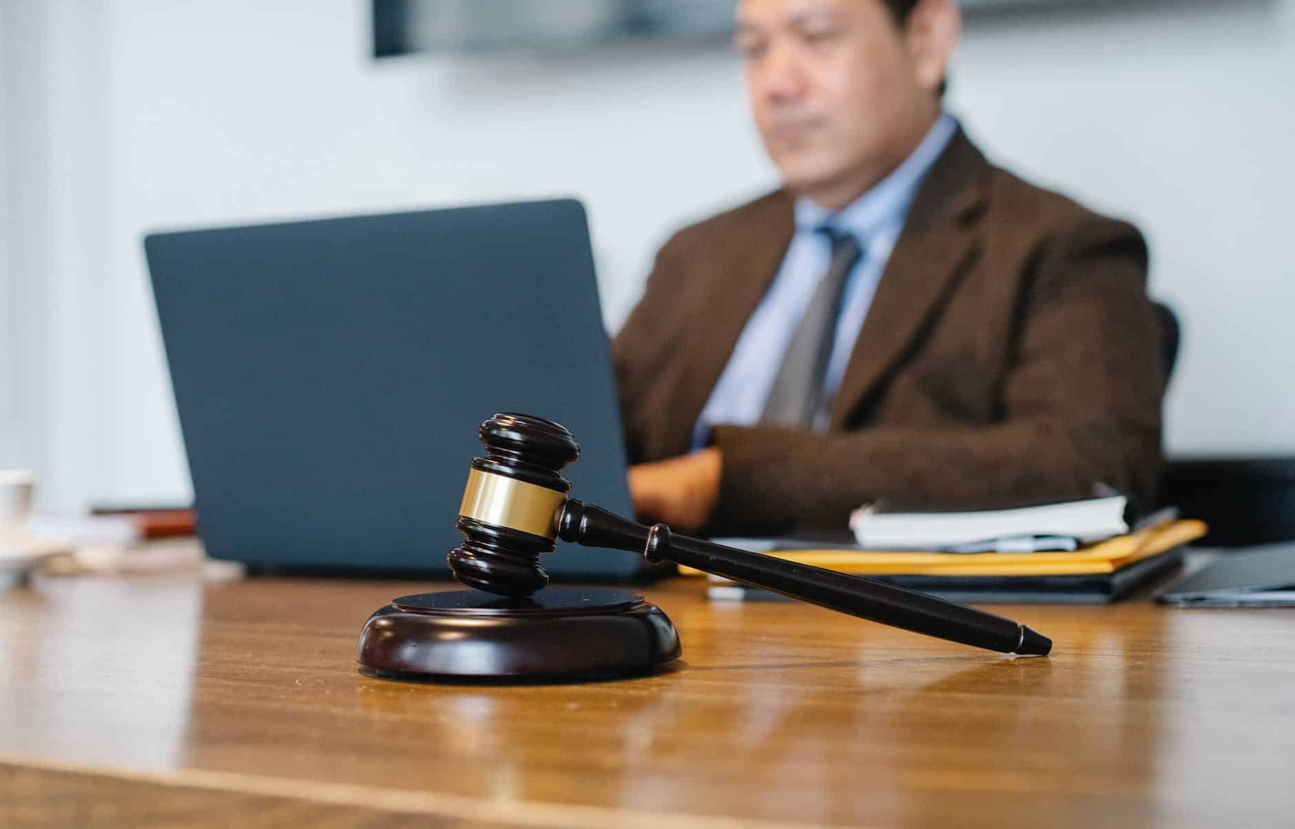 judge working on laptop with cameras in NY Courts