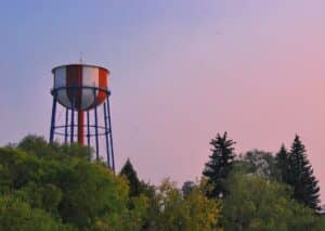 idaho falls water tower near green trees under evening sky